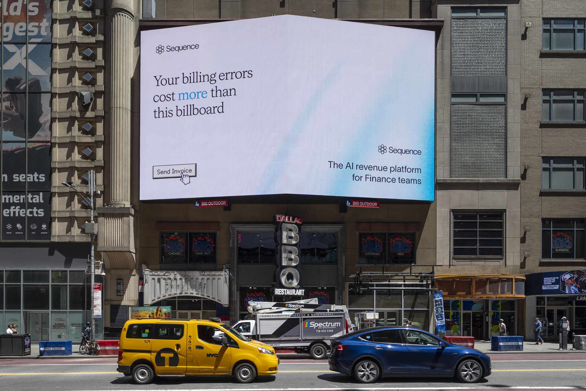 The campaign on a wide board above a Dallas BBQ on Times Square, with traffic passing underneath.